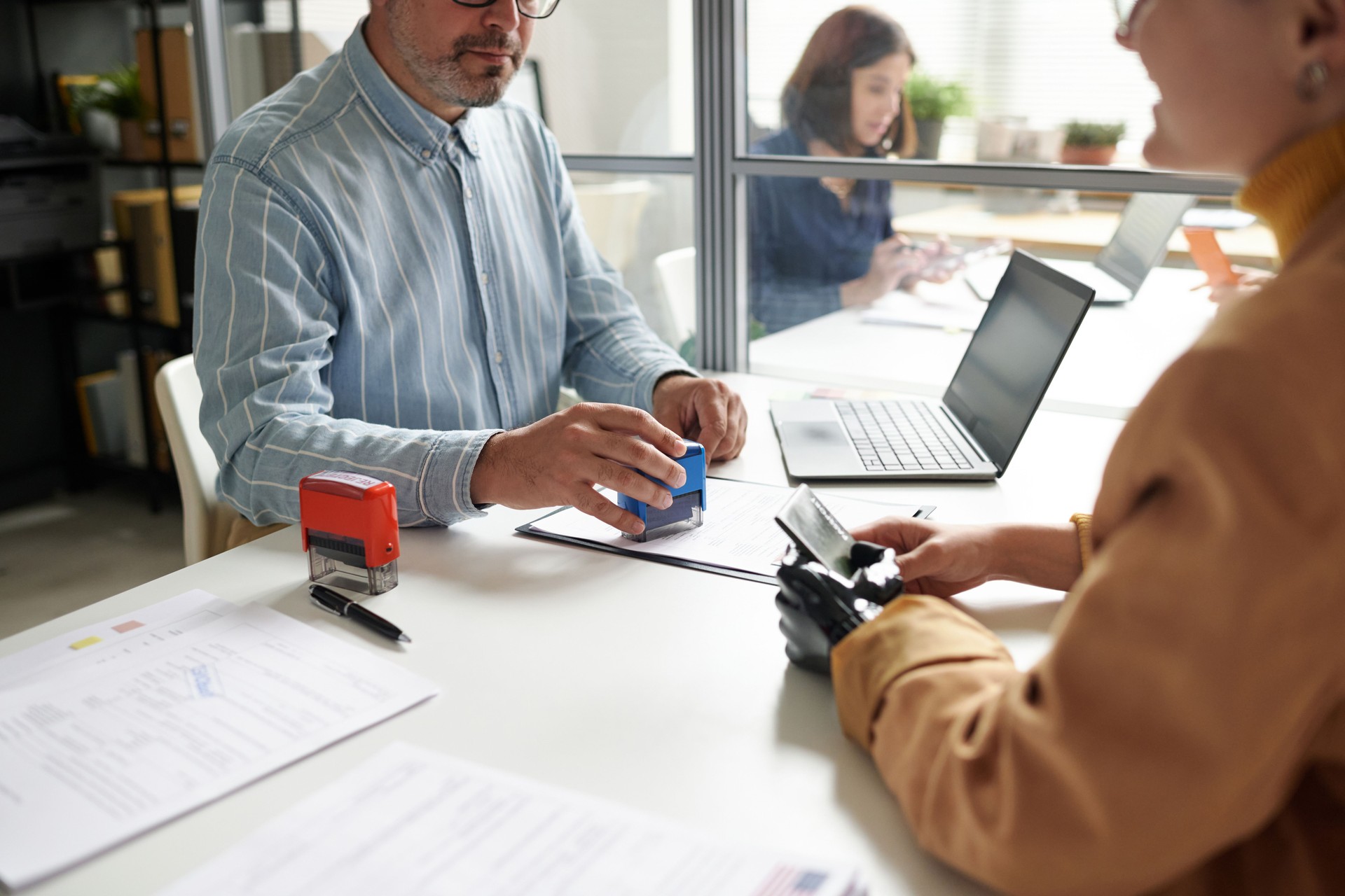 Manager of visa center having meeting with client